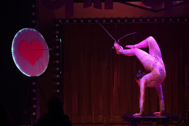 Handbalancing Contortionist with Foot Archery performer in costume at an event in the New York metropolitan area (image 5)