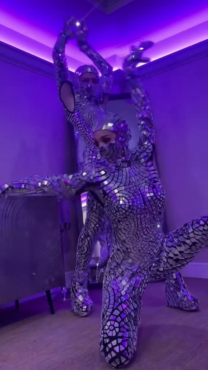 Mirror Ninjas in faceted mirror suits during a private nightlife performance