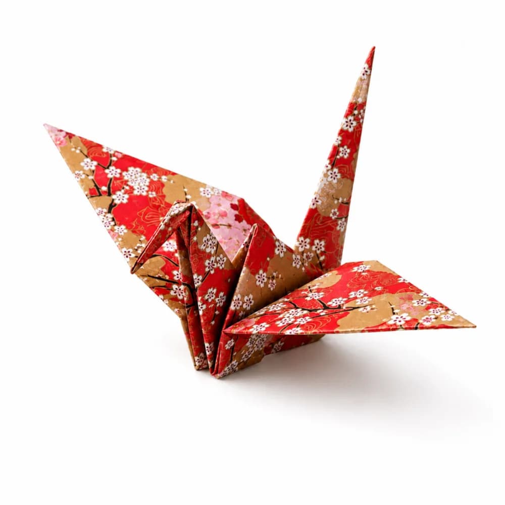Origami folding station with intricate paper art at an event