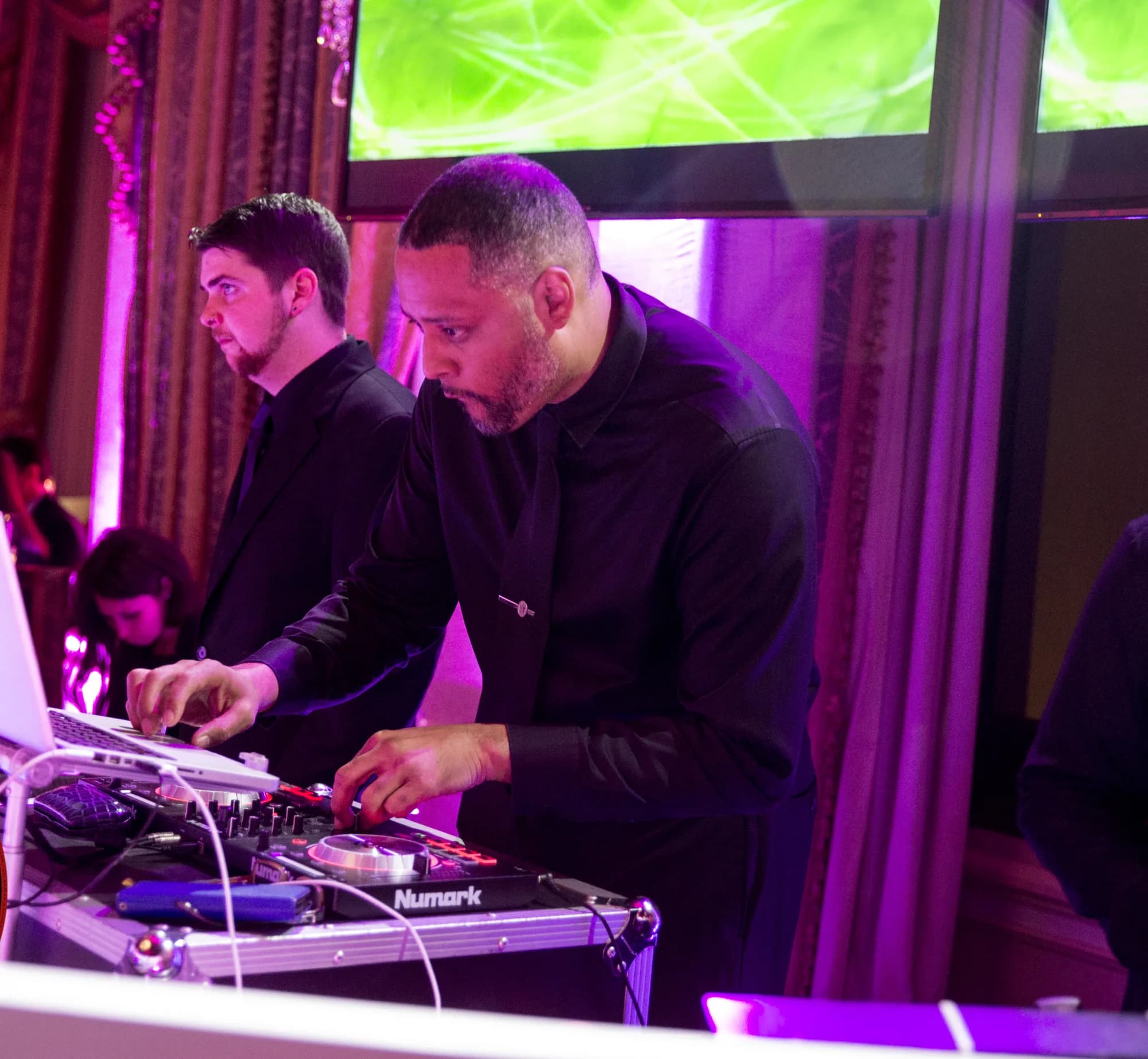 DJ David Raimer performing at the decks at a New York City venue event