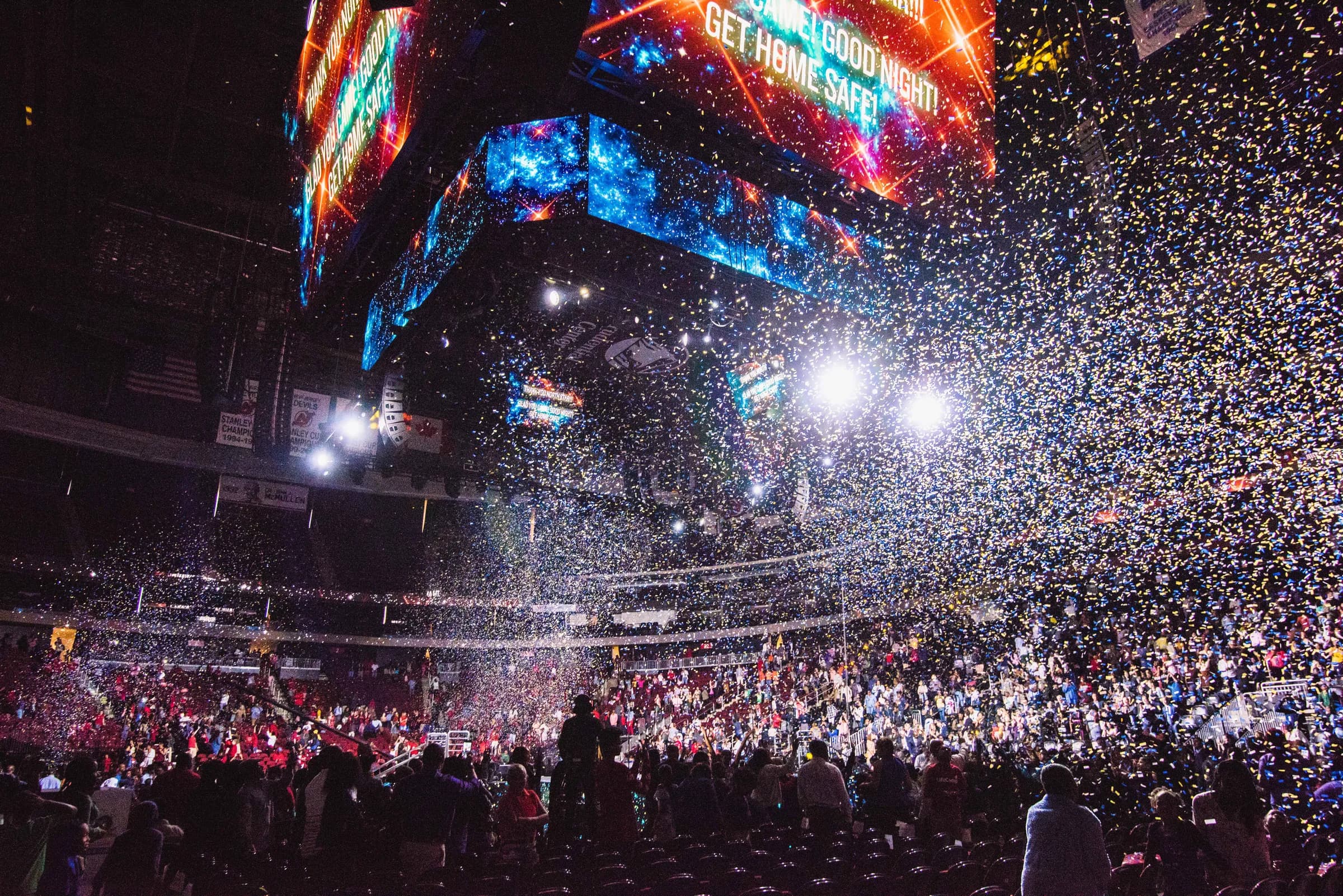 A large crowd in front of a giant LED wall at one of Gabriel's events, atmospheric backdrop