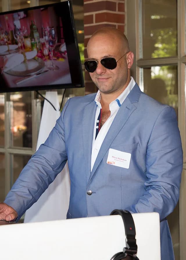 Shiran Nicholson in a blue blazer and sunglasses at the decks at a Greenwich Hyatt event