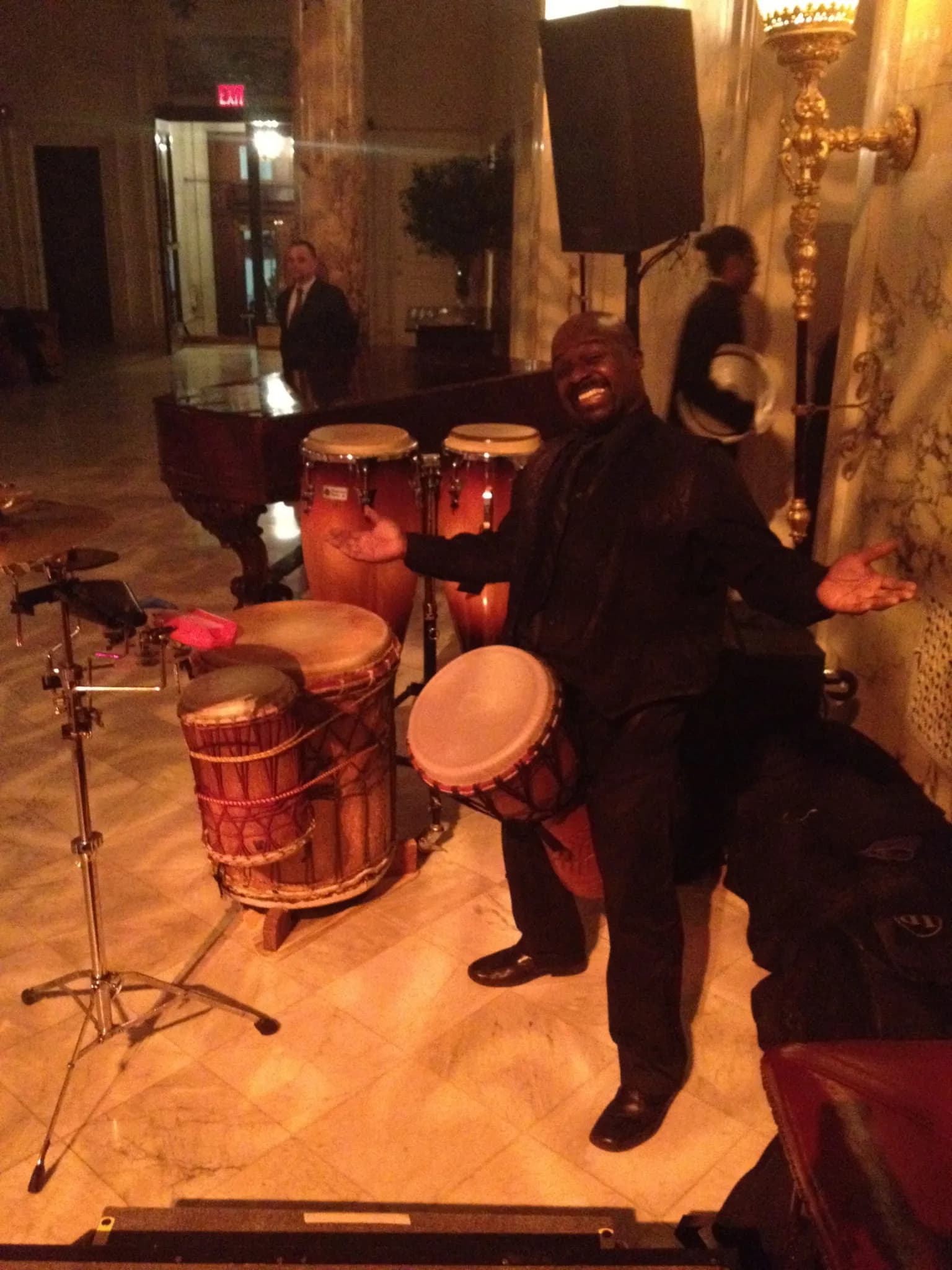 Live percussionist playing conga drums at a corporate event