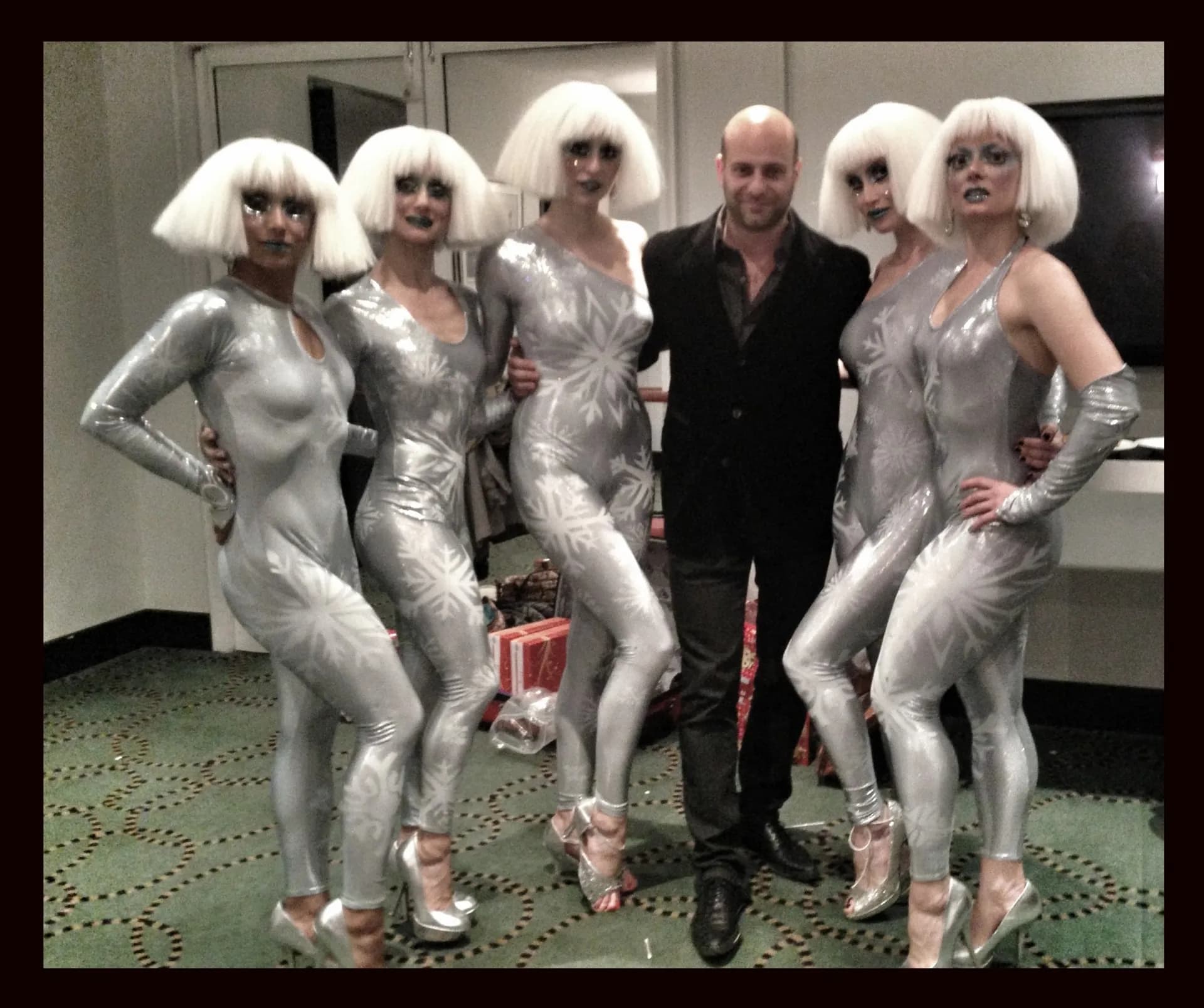 Silver costumed dancers performing at a luxury corporate event