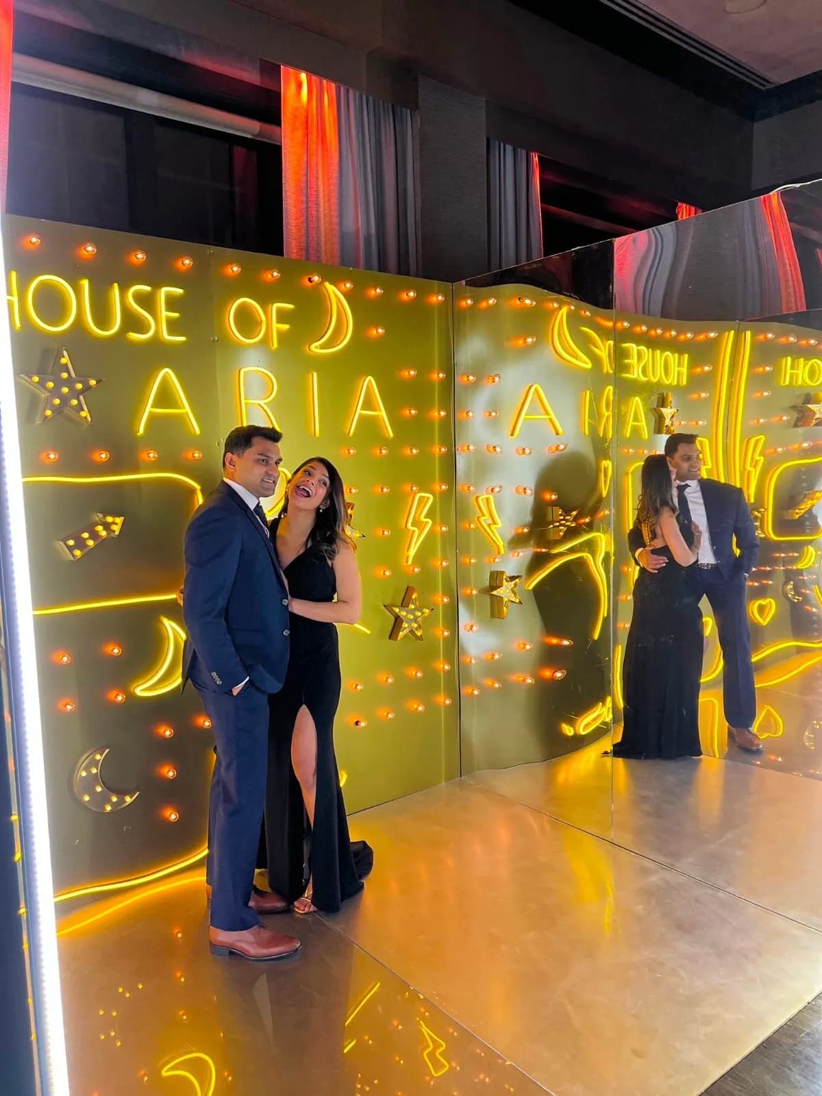 Gold neon lighting creates a glamorous backdrop at a wedding reception