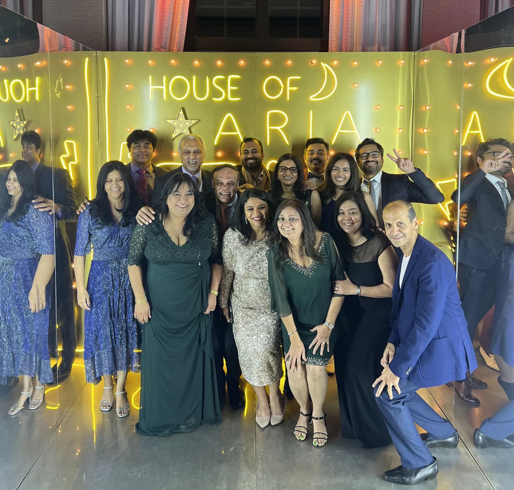Corporate event guests enjoying the Gold Neon Room photo experience
