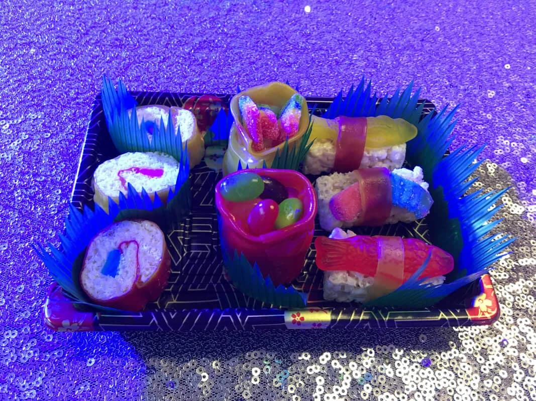 Vibrant neon-lit custom party favors on a sequined table at a Nicholson Events bar mitzvah celebration