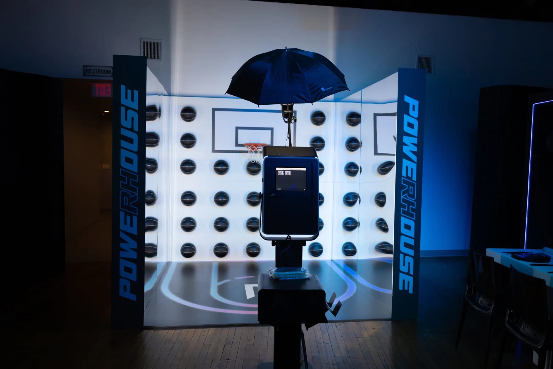An immersive themed photo booth environment with a custom backdrop built into the event decor