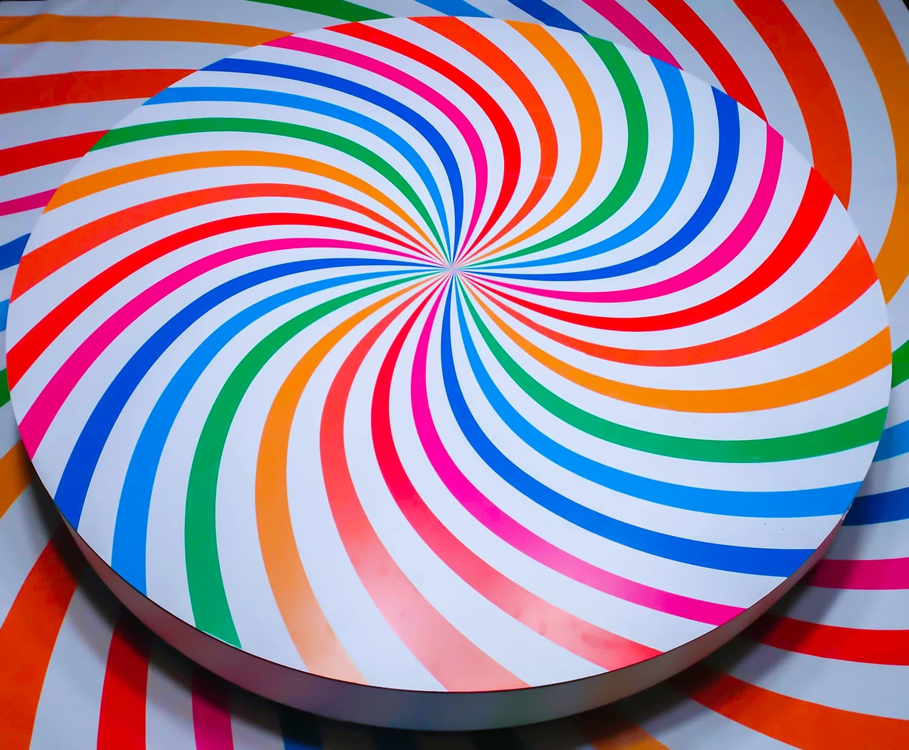 Close-up of the multicolor spiral top-spin rotational platform used for overhead 360 video capture