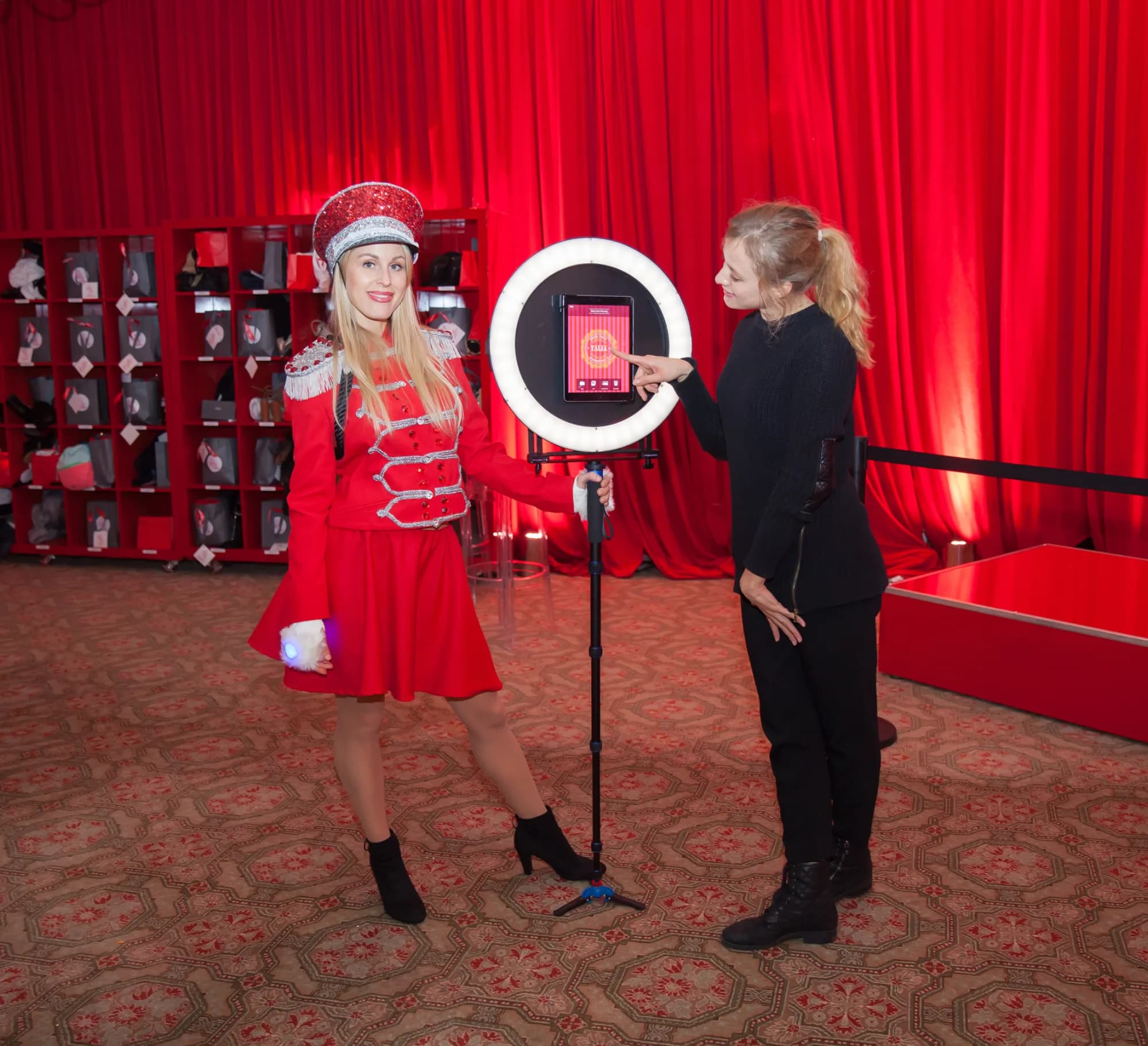 Roaming GIF attendant capturing a guest with ring light at an event