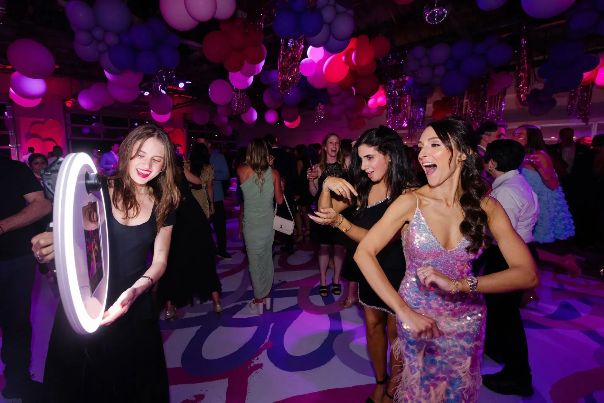 Roamer photo booth capturing candid moments on the dance floor at a mitzvah celebration